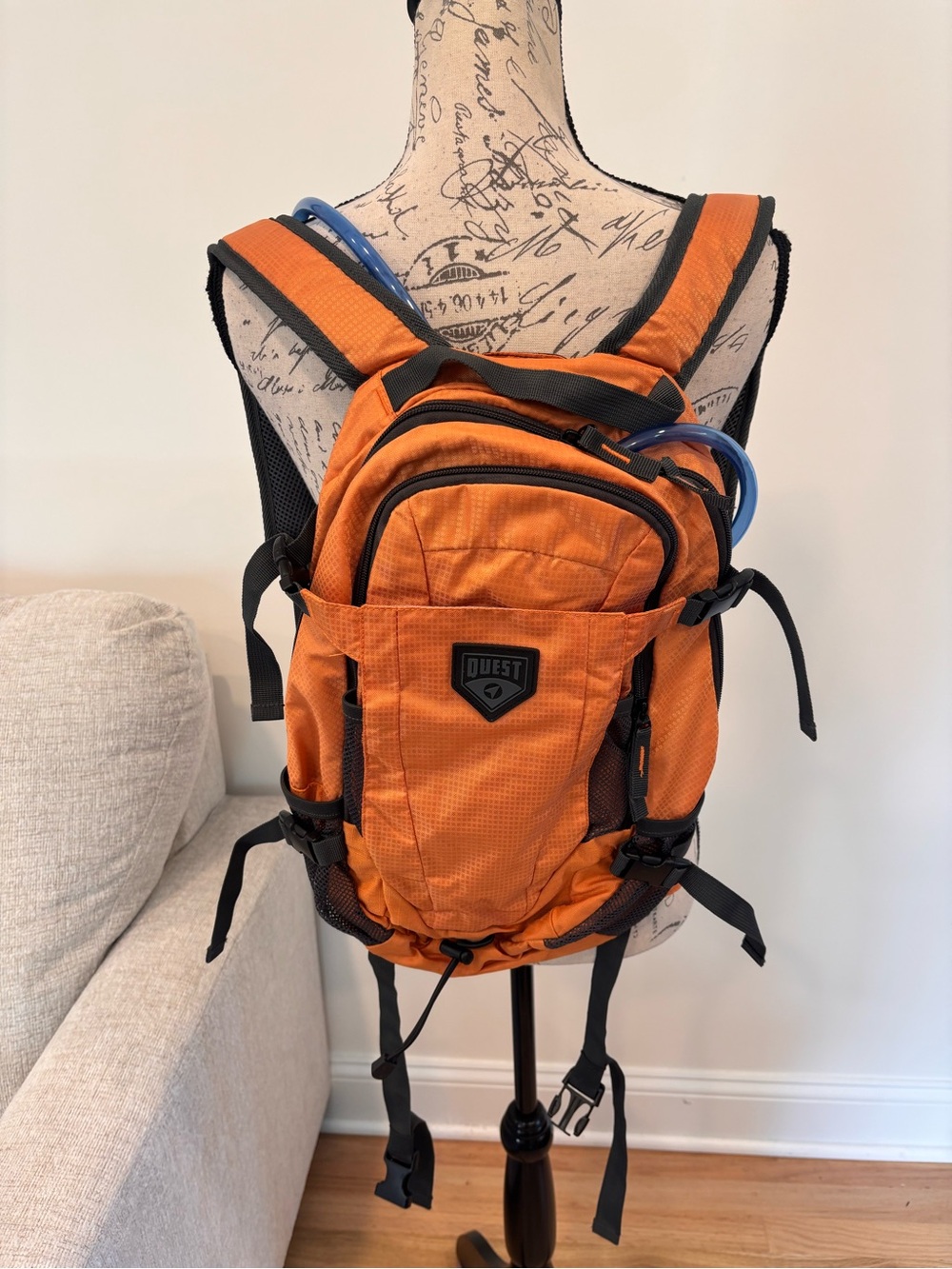 Quest 2L Hydration Pack in orange with a 2-liter water bladder